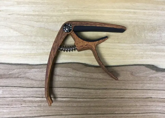Dark wood effect acoustic / electric guitar capo