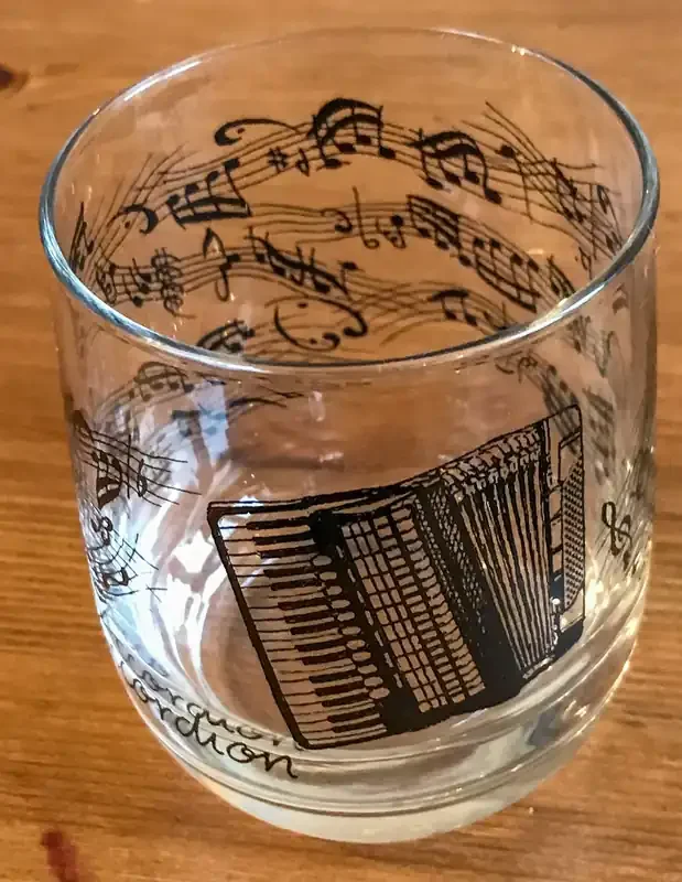 Drinking Glass featuring an Accordion